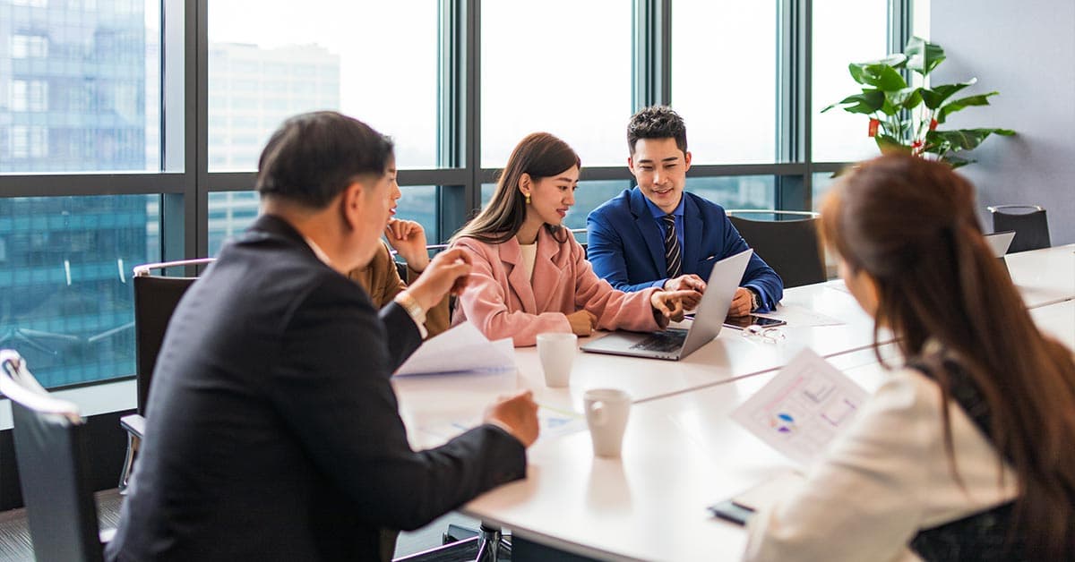 Team discussing business strategy in a modern office